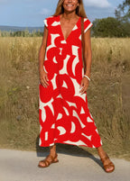 Robe longue d'été à motif rouge et blanc, col en V, femme debout en plein air