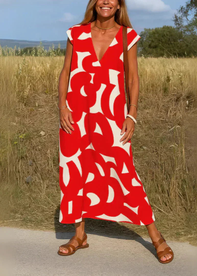 Robe longue d'été à motif rouge et blanc, col en V, femme debout en plein air